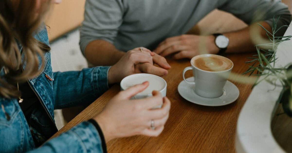 two mugs with coffee on table