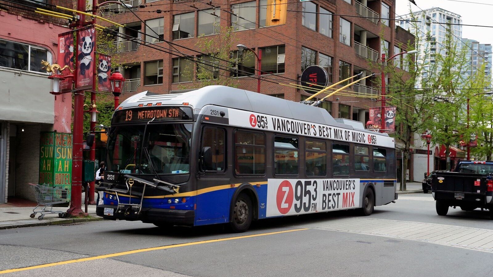 Electric bus on Columbia St in Vancouver's urban landscape, Chinatown district.