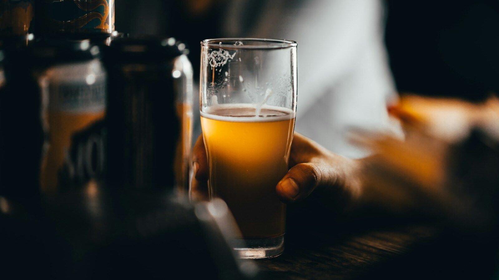 clear drinking glass with yellow liquid