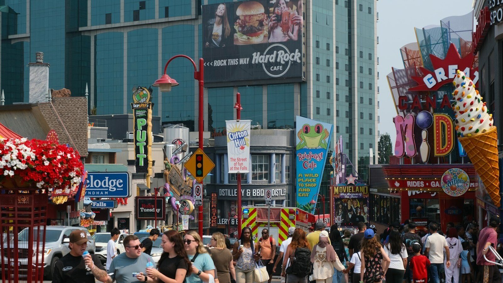 Crowded street with shops and tourists