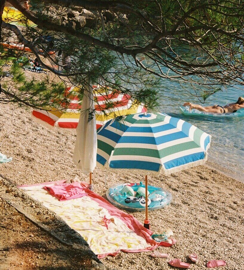 A beach with a lot of umbrellas on it