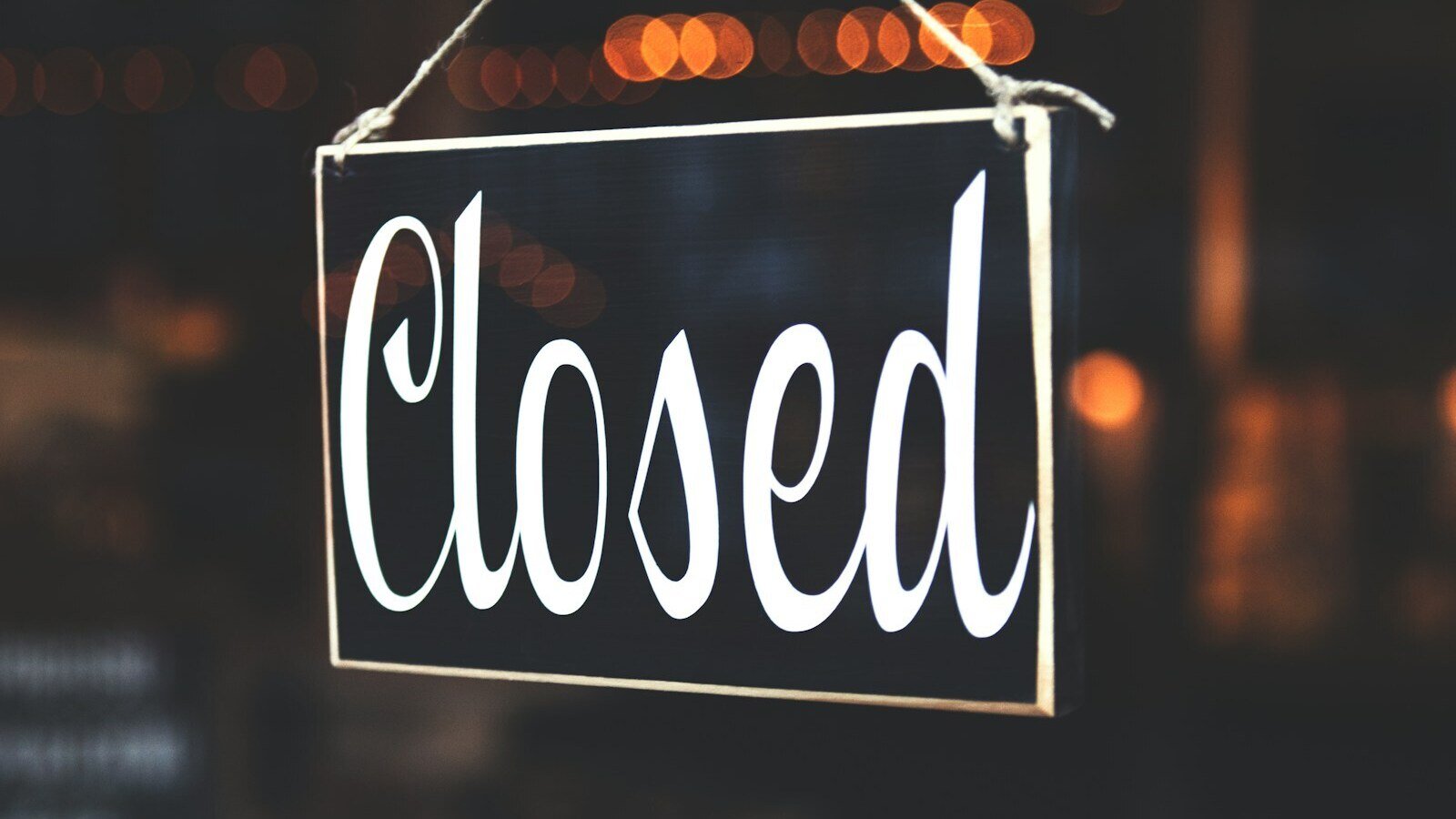 bokeh photography of closed signage