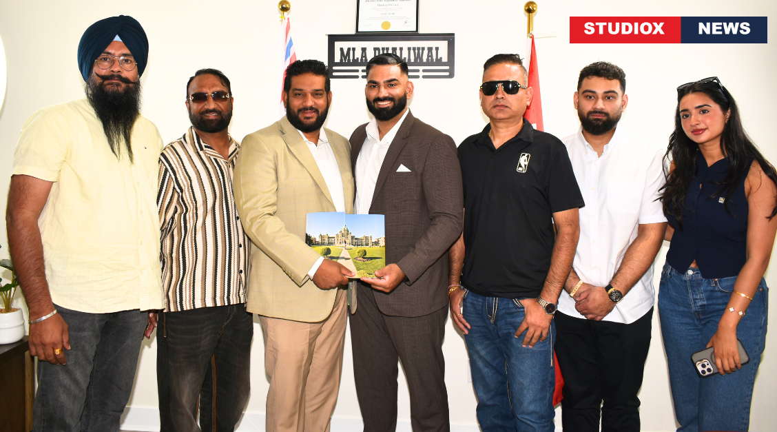 Surrey resident Moti Johal receiving a certificate of appreciation from MLA Mandeep Dhaliwal