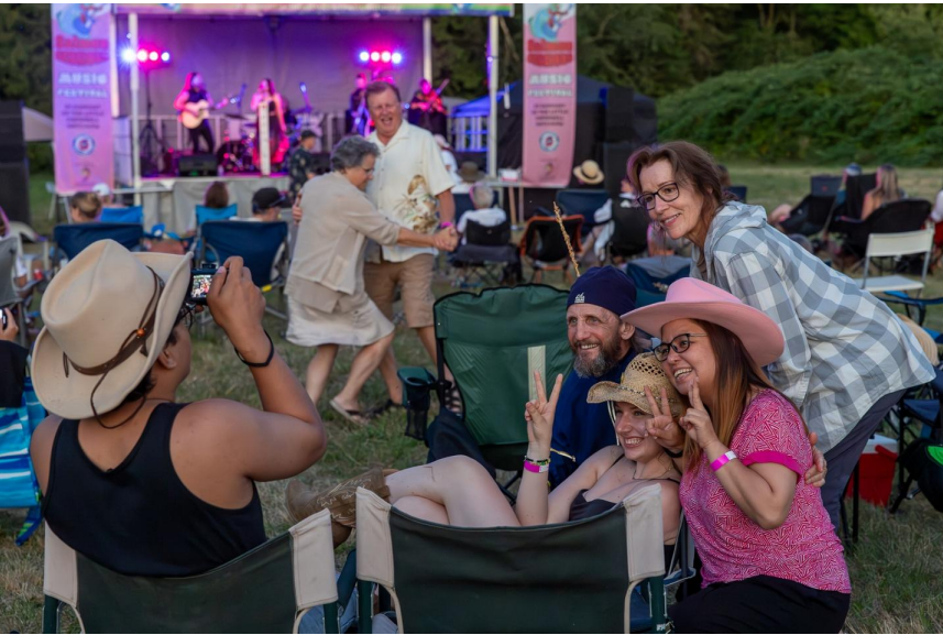 Families and friends enjoy Salmon Sessions Music Festival in South Surrey with live music stage in background