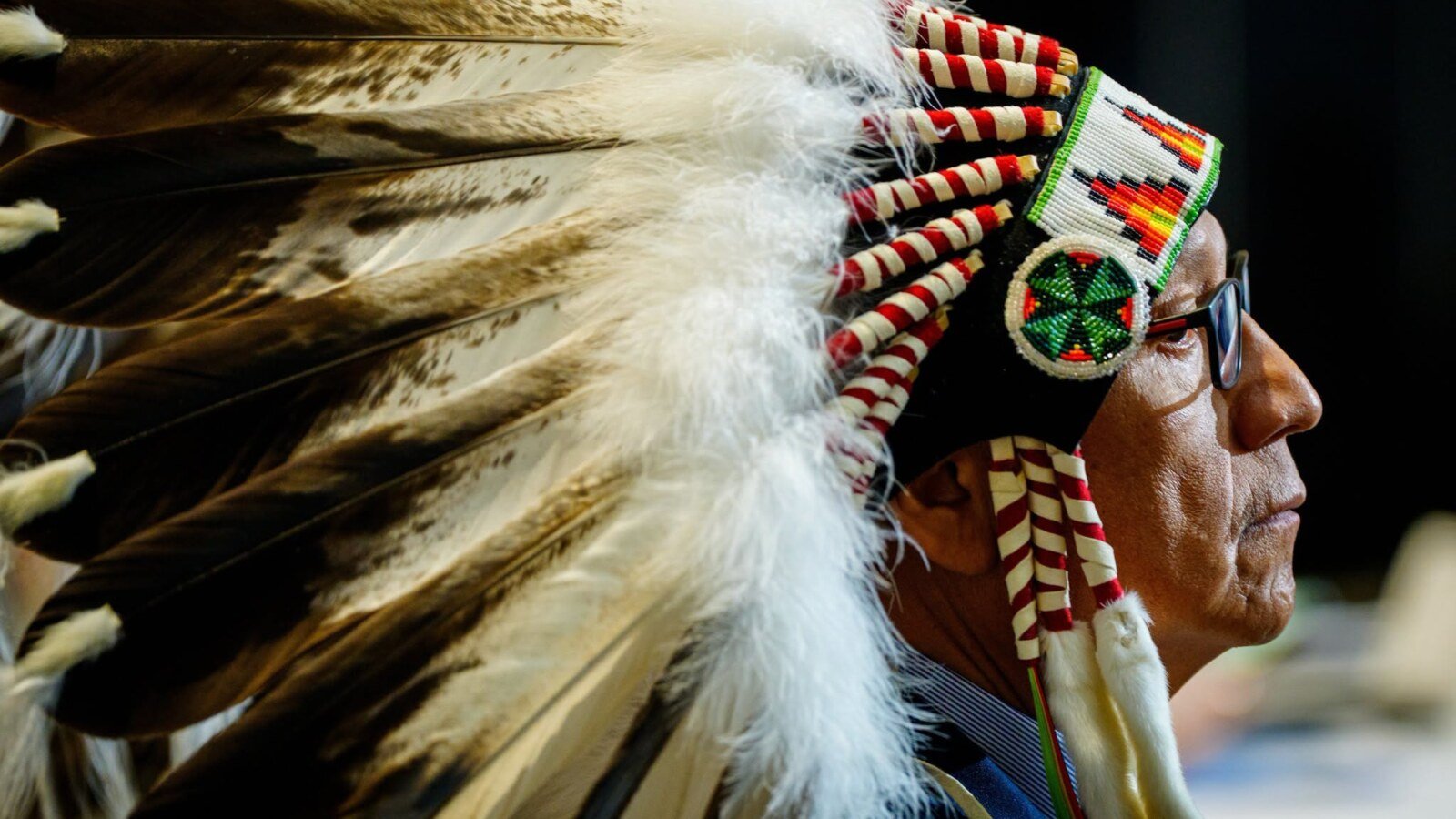 First Nations leader wearing traditional feather headdress at First Ministers meeting
