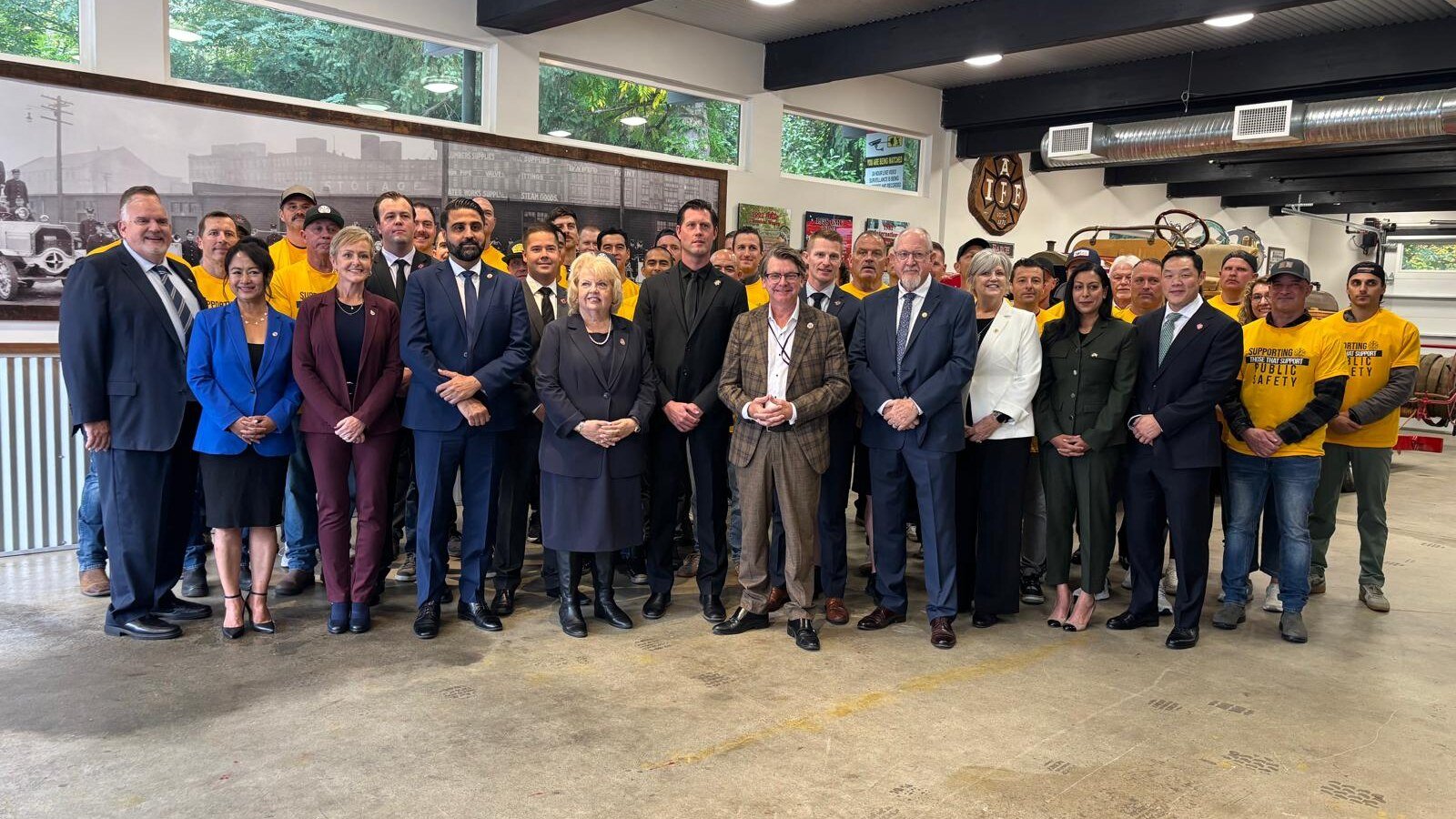 Surrey civic leaders and public-safety supporters gather for a group photo during a Surrey Connect campaign event.