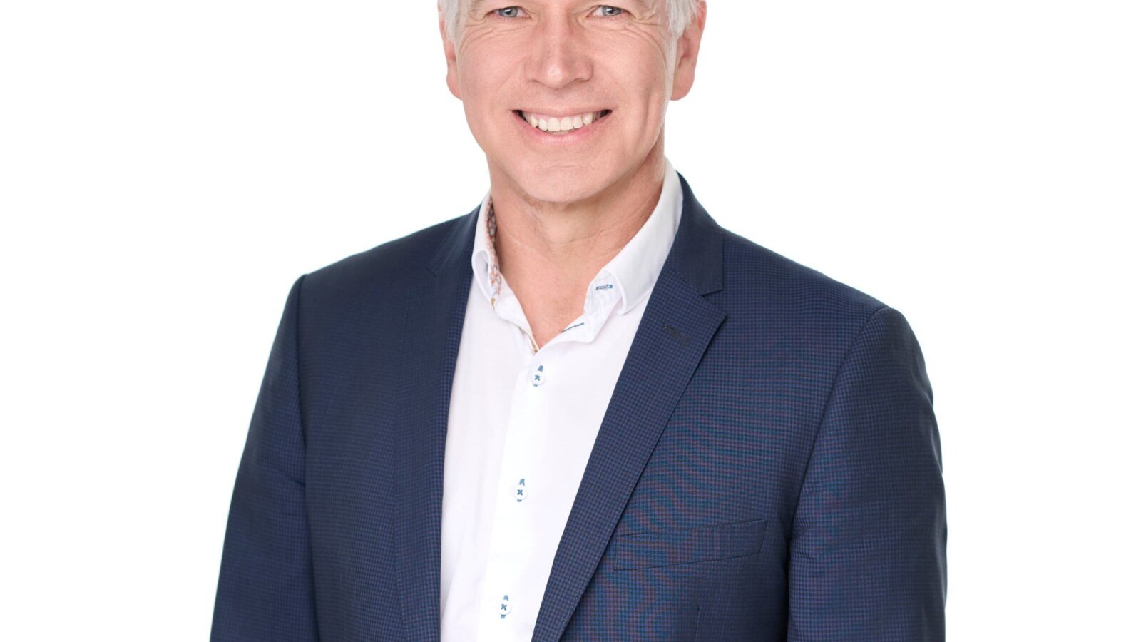 Ross Siemens in a navy suit and white shirt in an official campaign portrait.
